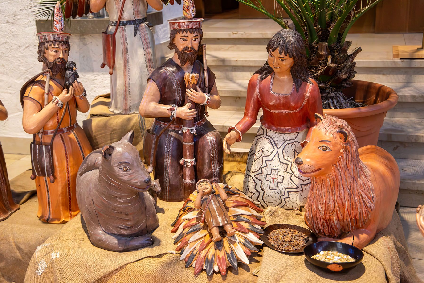 Die heilige Familie mit dem Jesuskind auf bunten Blättern